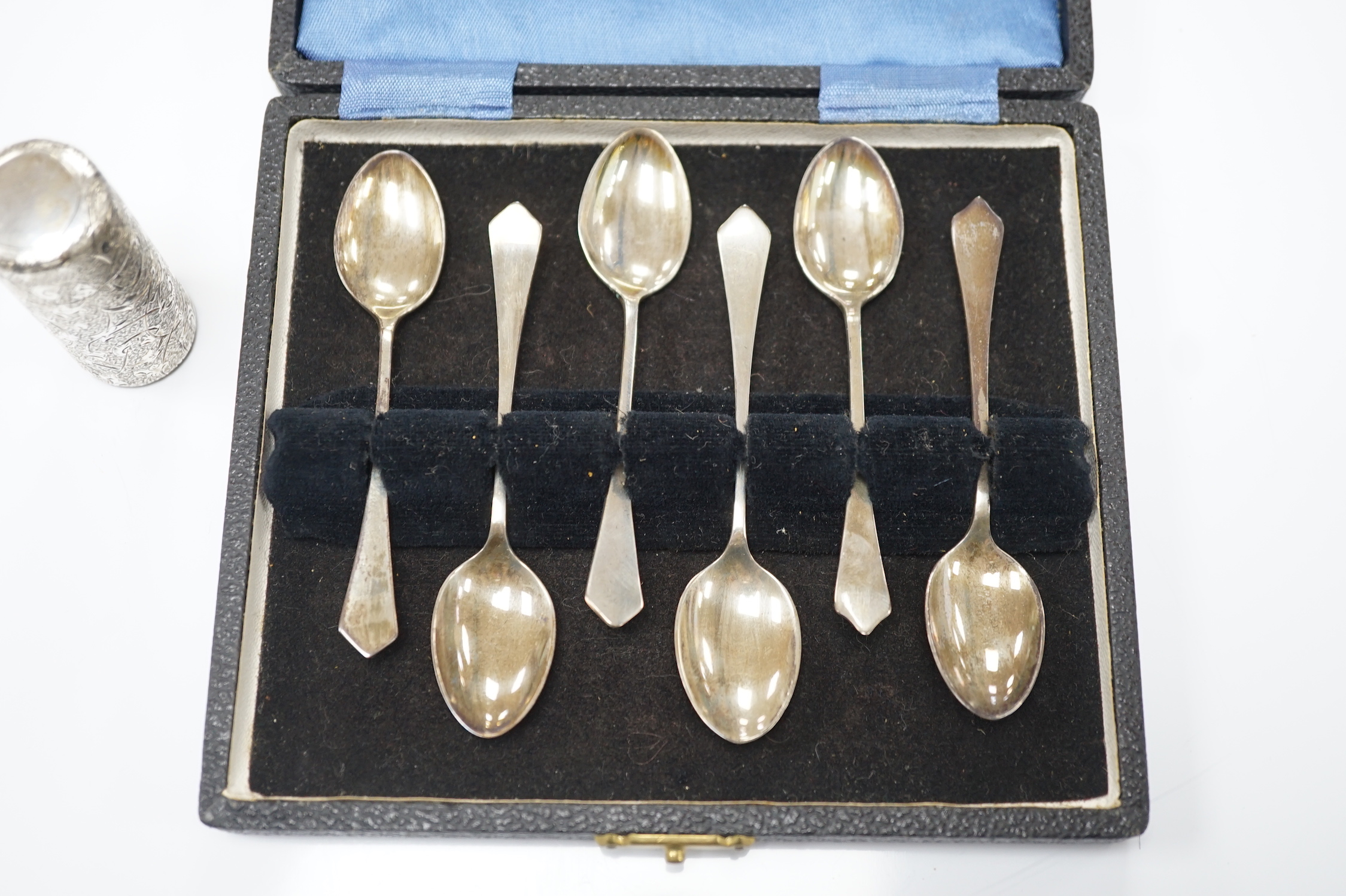 A late Victorian engraved silver cylindrical scent bottle, by Sampson Mordan & Co, London, 1882, 53mm, together with a later set of six silver coffee spoons.